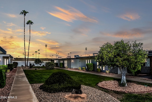 exterior space with a lawn and a water view