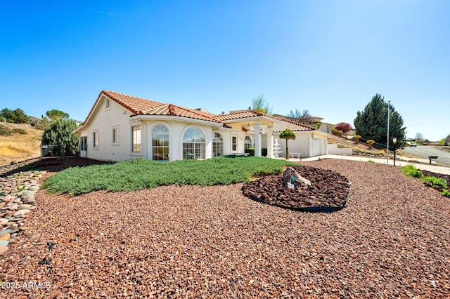 4701 N Sheridan Ln, Prescott Valley, AZ 86314 - view of front of property featuring a tiled roof, stucco siding, and an attached garage