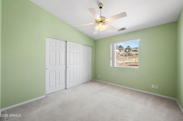 4701 N Sheridan Ln, Prescott Valley, AZ 86314 - unfurnished bedroom featuring carpet flooring, baseboards, a closet, lofted ceiling, and ceiling fan