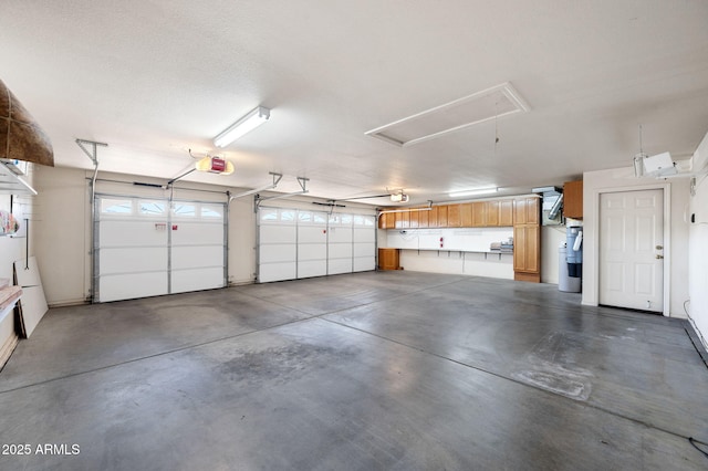 4701 N Sheridan Ln, Prescott Valley, AZ 86314 - garage with electric water heater and a garage door opener