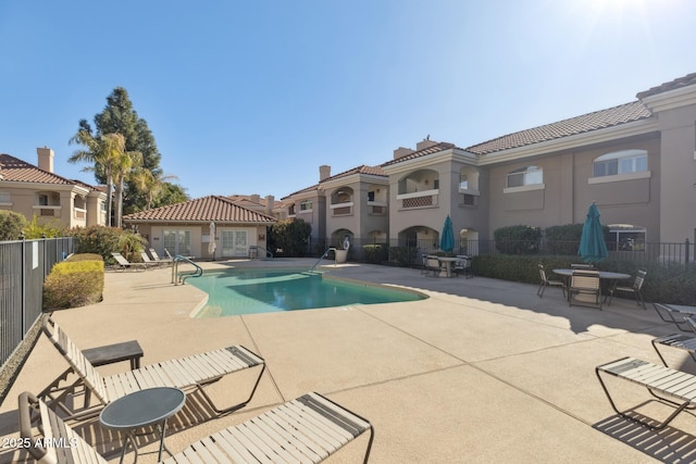 view of swimming pool with a patio area