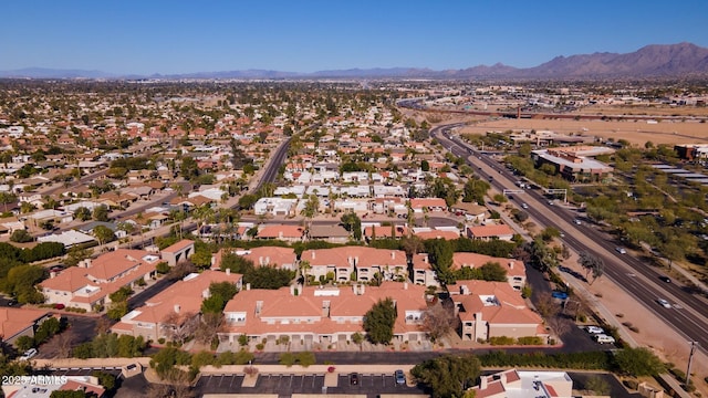 birds eye view of property featuring a mountain view