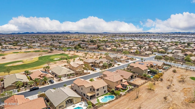 aerial view with view of golf course and a residential view