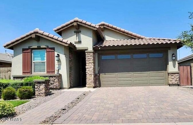 view of front of property with a garage