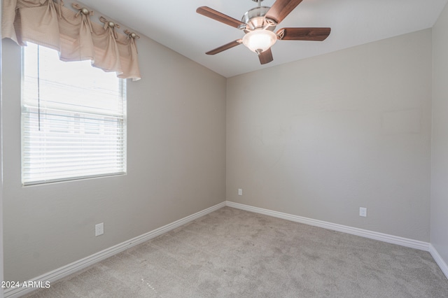 carpeted empty room with ceiling fan