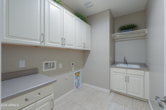 laundry room featuring cabinets, washer hookup, electric dryer hookup, sink, and hookup for a gas dryer