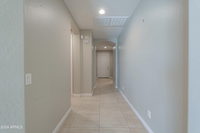 corridor with light tile patterned floors