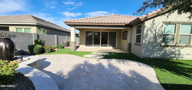 back of property with a patio area