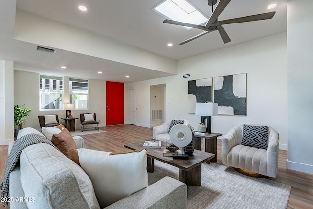 living room with hardwood / wood-style floors and ceiling fan