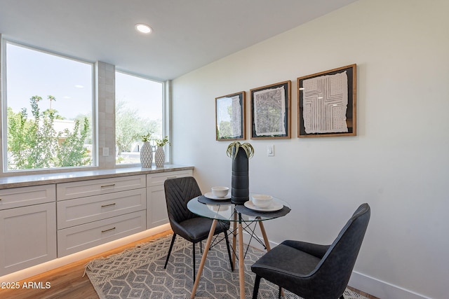 dining room with hardwood / wood-style floors