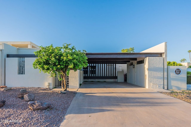 contemporary home with a carport