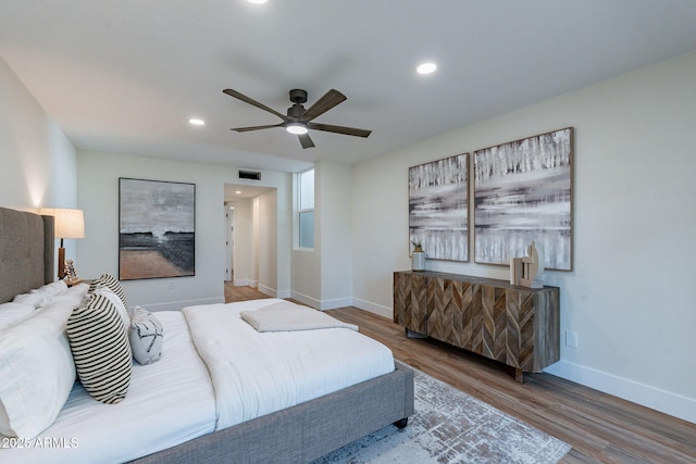 bedroom featuring hardwood / wood-style flooring and ceiling fan