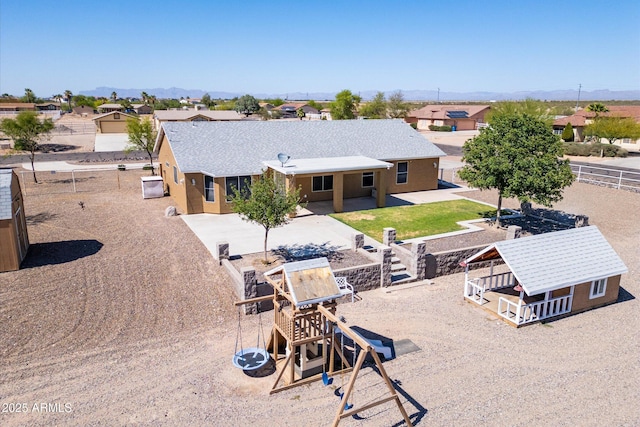 23705 N Chaps Dr, Florence, AZ 85132 - rear view of property featuring a fenced backyard, a patio area, and a residential view
