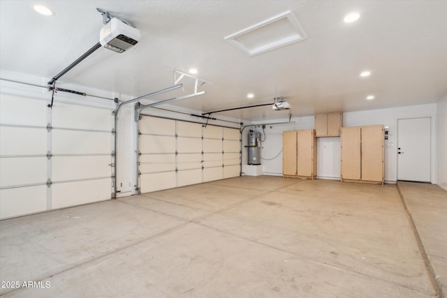 23705 N Chaps Dr, Florence, AZ 85132 - garage featuring a garage door opener, a central vacuum unit, and recessed lighting