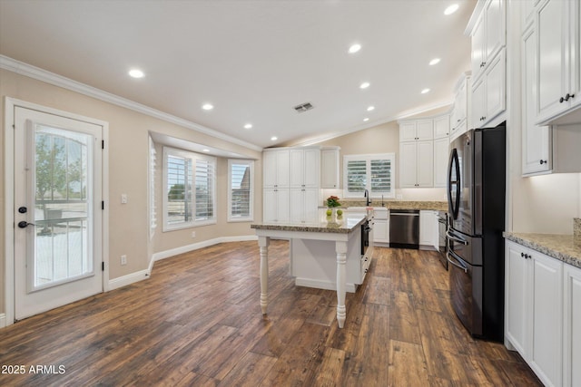 23705 N Chaps Dr, Florence, AZ 85132 - kitchen with dishwasher, freestanding refrigerator, ornamental molding, white cabinets, and a center island