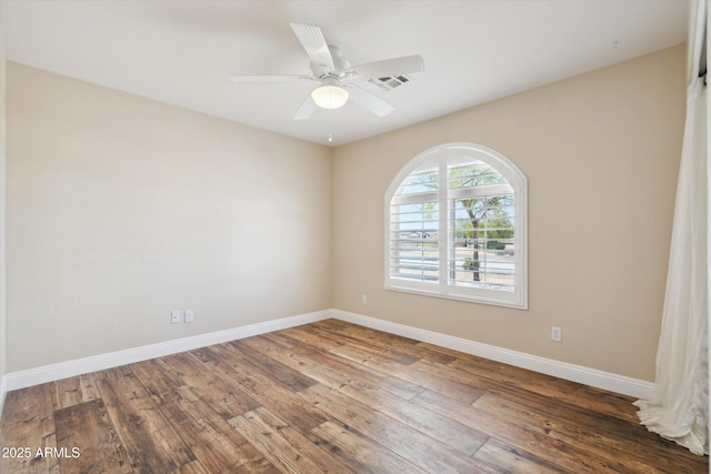23705 N Chaps Dr, Florence, AZ 85132 - empty room featuring hardwood / wood-style flooring, baseboards, and a ceiling fan