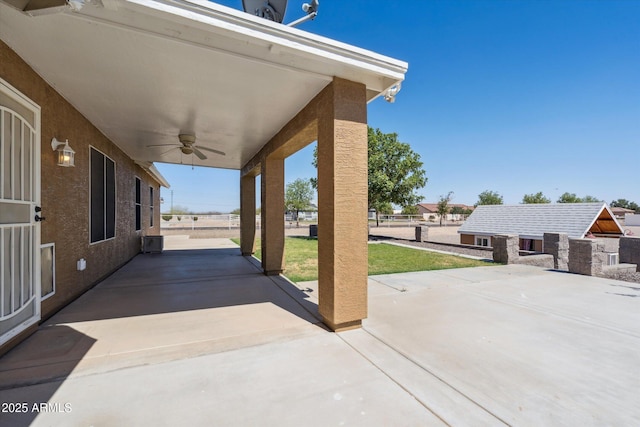 23705 N Chaps Dr, Florence, AZ 85132 - view of patio / terrace featuring a ceiling fan and an outbuilding