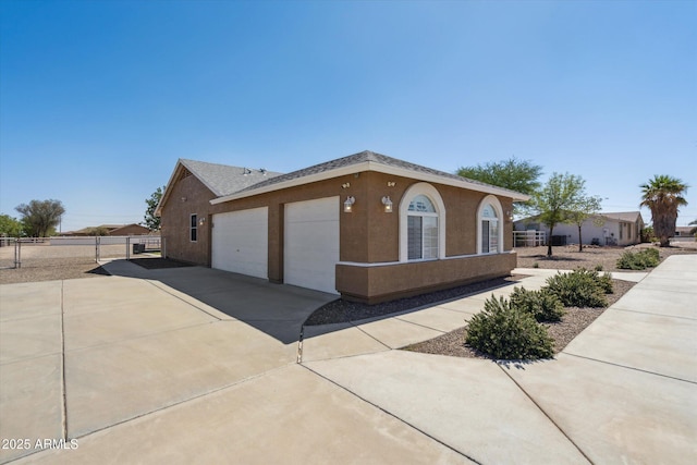 23705 N Chaps Dr, Florence, AZ 85132 - view of front of property with driveway, an attached garage, and stucco siding