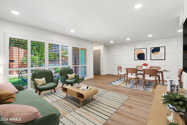 living room with light hardwood / wood-style flooring