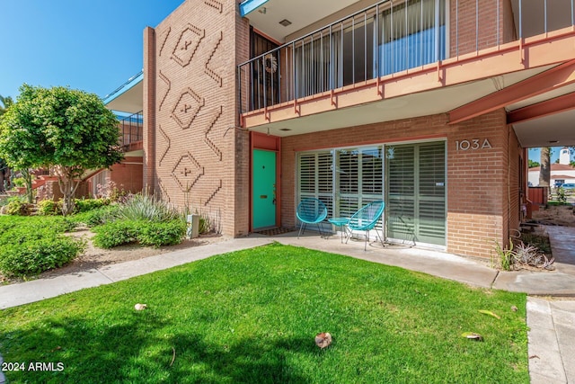 103 E Palm Ln Unit A, Phoenix, AZ 85004 - doorway to property with brick siding and a lawn