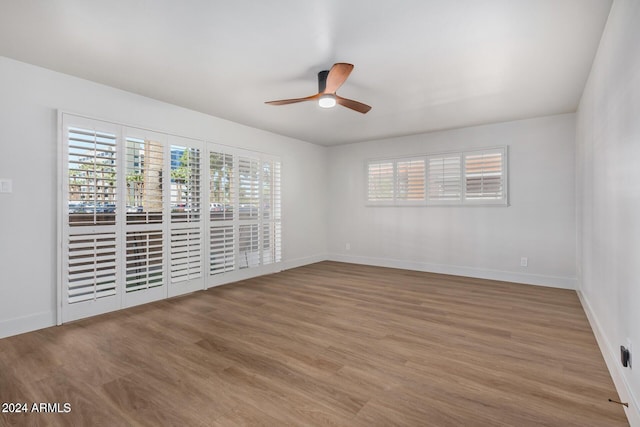 103 E Palm Ln Unit A, Phoenix, AZ 85004 - spare room with ceiling fan, baseboards, and light wood finished floors