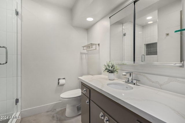 103 E Palm Ln Unit A, Phoenix, AZ 85004 - full bathroom with a shower stall, toilet, vanity, tile patterned flooring, and recessed lighting