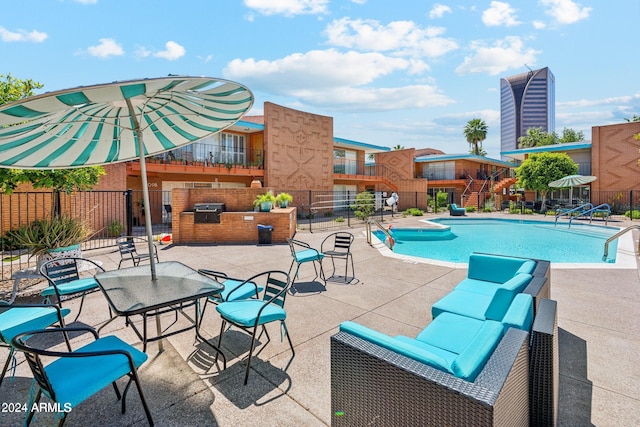 103 E Palm Ln Unit A, Phoenix, AZ 85004 - community pool with fence, exterior kitchen, and a patio