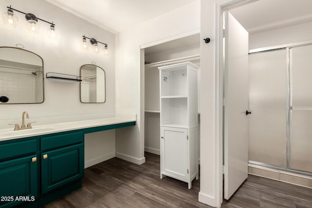 830 E Gila Ln, Chandler, AZ 85225 - bathroom featuring a stall shower, wood finished floors, vanity, and baseboards