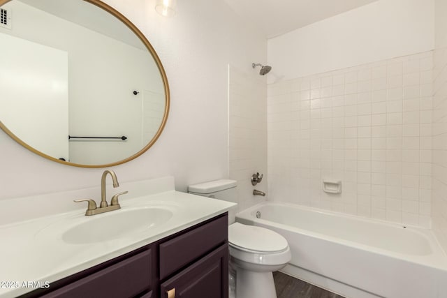 830 E Gila Ln, Chandler, AZ 85225 - bathroom with toilet, vanity, washtub / shower combination, and wood finished floors