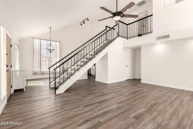 830 E Gila Ln, Chandler, AZ 85225 - unfurnished living room with stairway, high vaulted ceiling, ceiling fan, wood finished floors, and baseboards