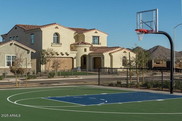 view of sport court with a mountain view