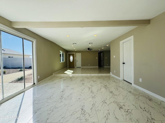 empty room with marble finish floor, recessed lighting, beam ceiling, and baseboards