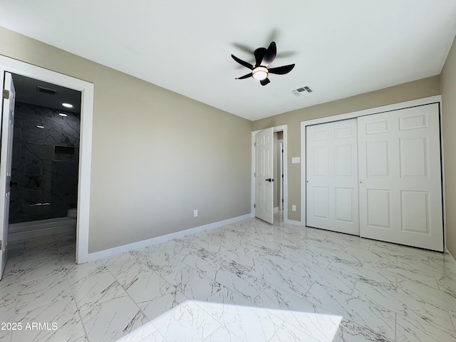 unfurnished bedroom with marble finish floor, visible vents, baseboards, and a closet