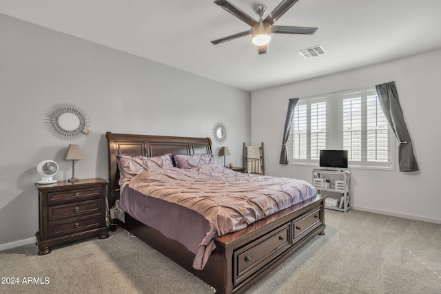 bedroom featuring ceiling fan and light carpet