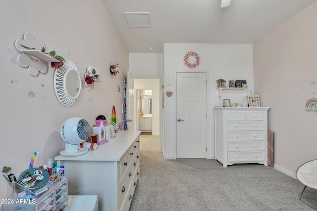 bedroom featuring light colored carpet and ceiling fan