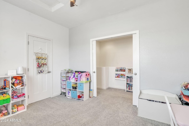 game room featuring light carpet