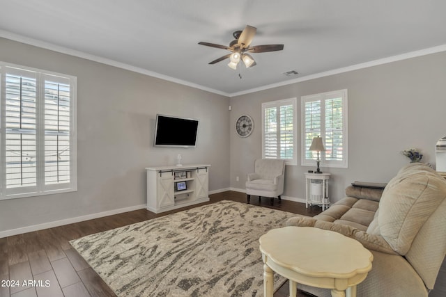 living room with ornamental molding, ceiling fan, and dark hardwood / wood-style floors