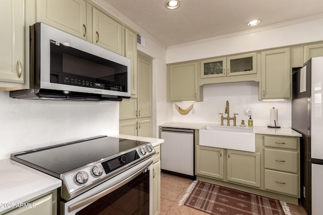 5031 W Grandview Rd, Glendale, AZ 85306 - kitchen featuring electric range, dishwashing machine, a sink, crown molding, and light countertops