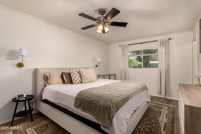 5031 W Grandview Rd, Glendale, AZ 85306 - bedroom with dark wood-style floors, crown molding, a ceiling fan, and baseboards