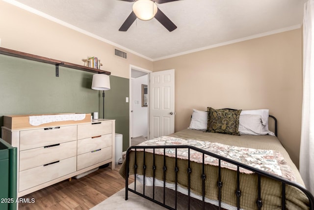 5031 W Grandview Rd, Glendale, AZ 85306 - bedroom with wood finished floors, crown molding, and a ceiling fan