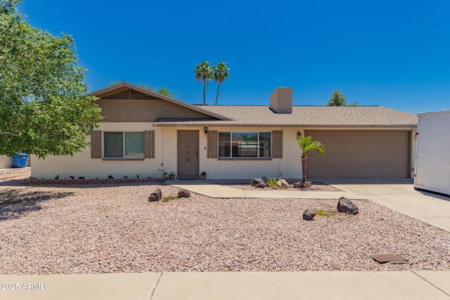 5031 W Grandview Rd, Glendale, AZ 85306 - ranch-style house with an attached garage, concrete driveway, a chimney, and a shingled roof