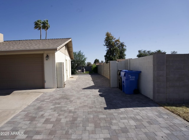 5031 W Grandview Rd, Glendale, AZ 85306 - view of property exterior featuring driveway, fence, and an attached garage