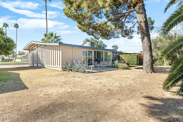 rear view of house featuring a patio