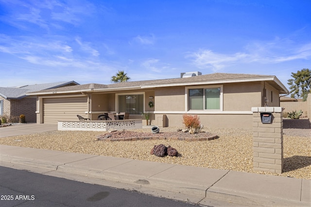 ranch-style home featuring a garage