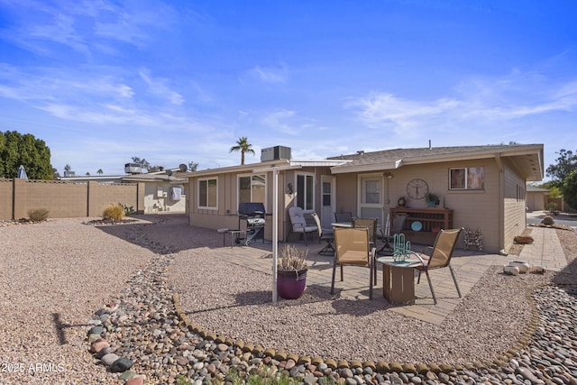 back of house with central AC unit and a patio area