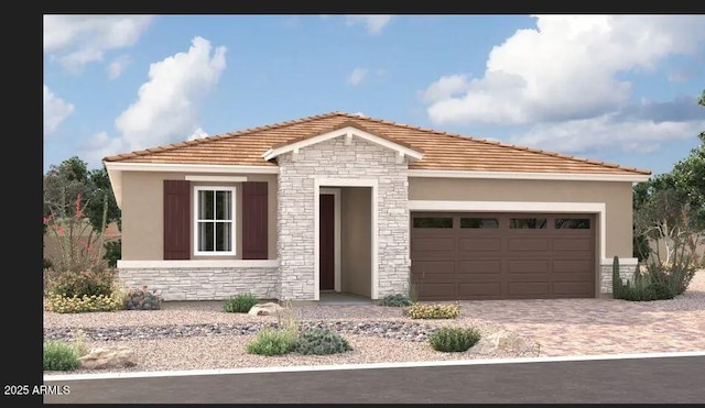 5006 W Hardtack Trl, Laveen, AZ 85339 - view of front of property featuring stone siding, an attached garage, driveway, and stucco siding