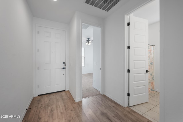 entryway featuring ceiling fan and light wood-type flooring