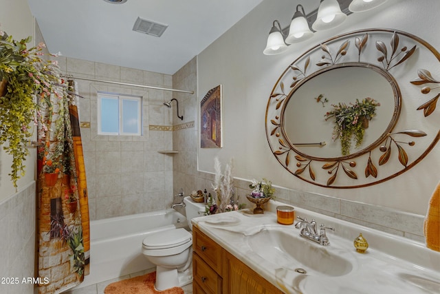 bathroom featuring visible vents, toilet, tile walls, and shower / bath combo