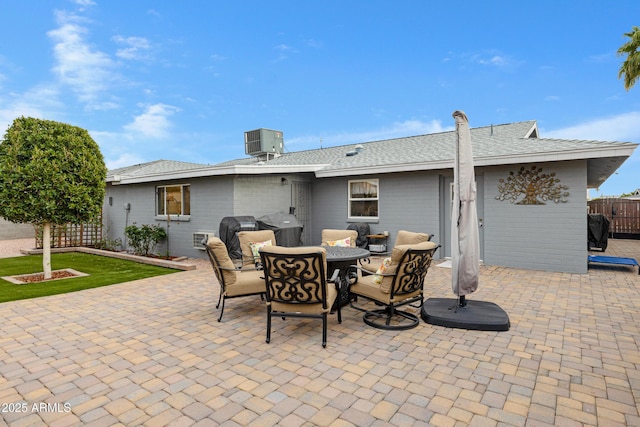 view of patio / terrace with outdoor dining space, area for grilling, cooling unit, and fence