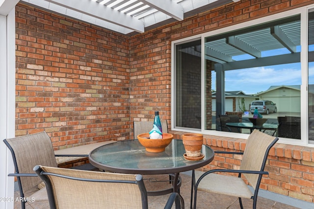 view of patio / terrace with a pergola and outdoor dining area